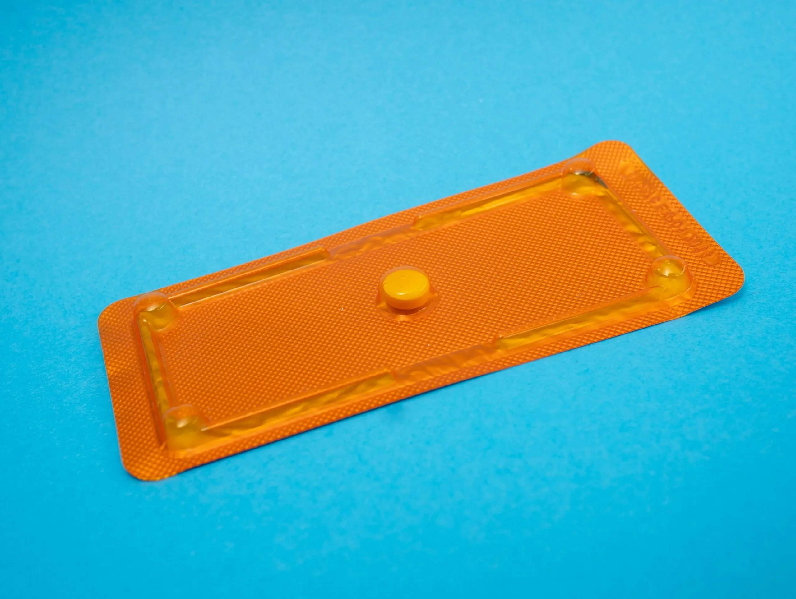 round orange medication pill