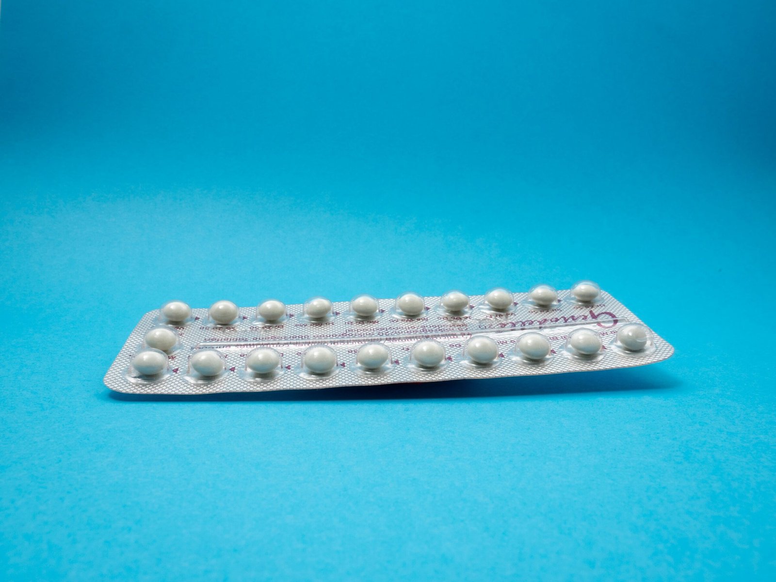 oral contraceptive pill on blue panel - danazol