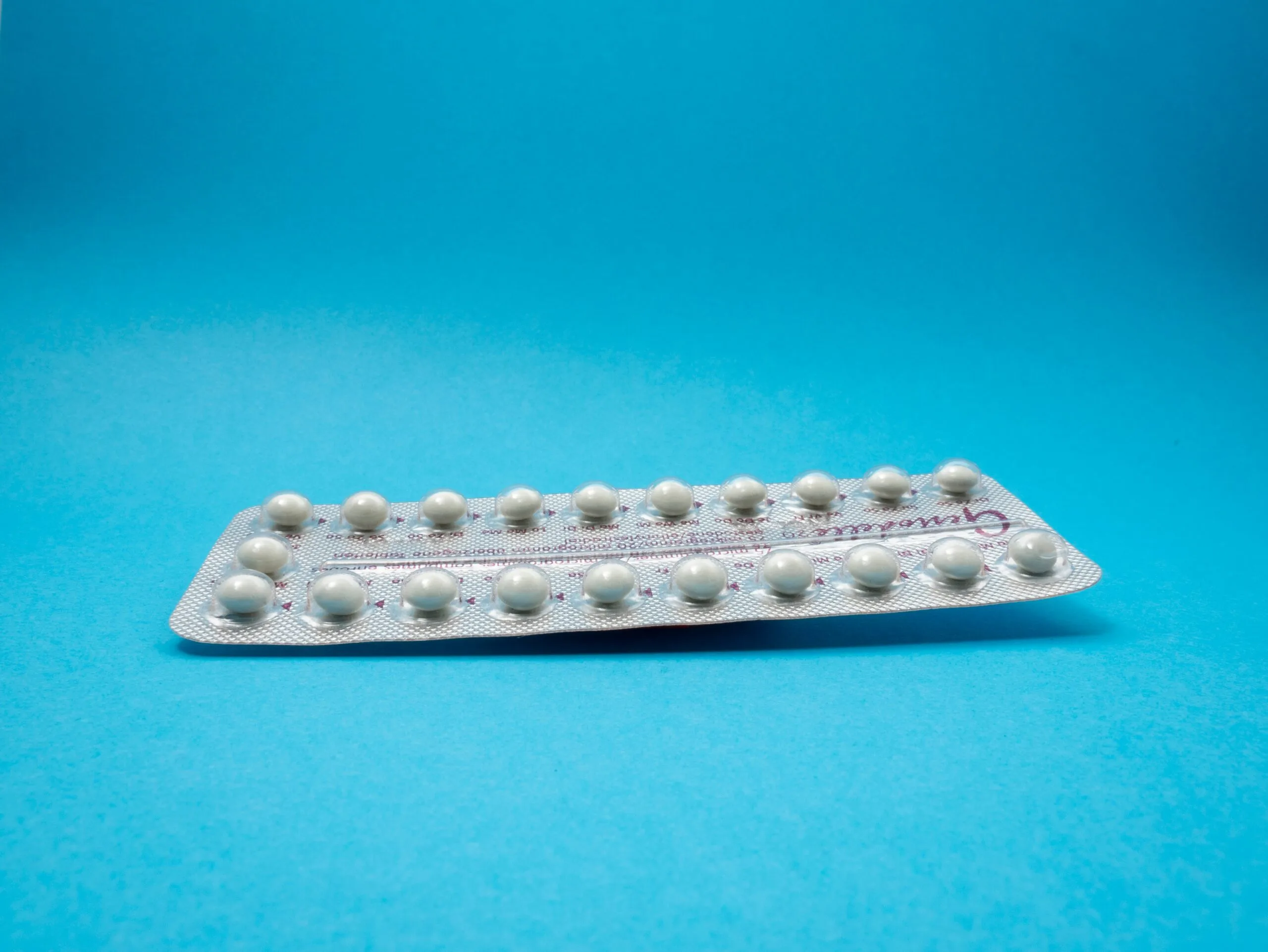 oral contraceptive pill on blue panel - danazol, cabergolina