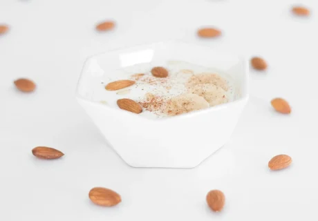 white ceramic bowl with brown liquid - iogurte natural integral
