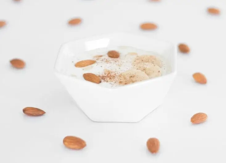 white ceramic bowl with brown liquid - iogurte natural integral